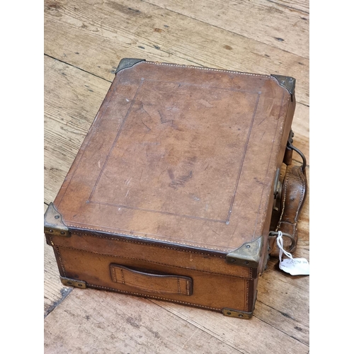 1701 - An old tan leather and brass bound cartridge case, (now with void interior), 33cm wide. ... 