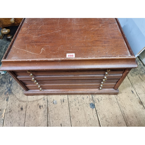 498 - A modern mahogany coin collector's chest, having six drawers, 52cm wide.