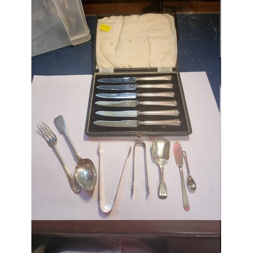 559 - A cased set of six silver handled tea knives; together with a Victorian silver fiddle pattern caddy ... 