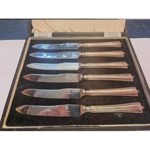 559 - A cased set of six silver handled tea knives; together with a Victorian silver fiddle pattern caddy ... 