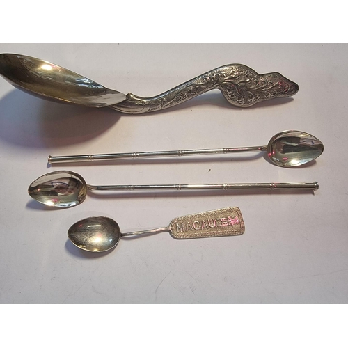 575 - A pair of white metal mate spoons, stamped 'W K 925 Sterling', 19.5cm; together with a Macau white m... 