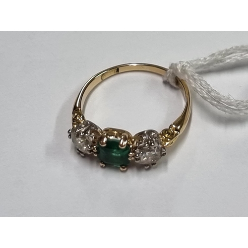 684 - A yellow metal emerald doublet and diamond three stone ring, stamped 18ct, size O.