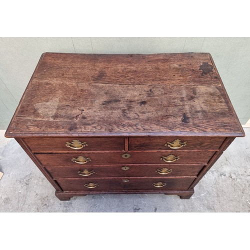 1026 - An 18th century oak panelled chest of drawers, 87cm wide.   ... 