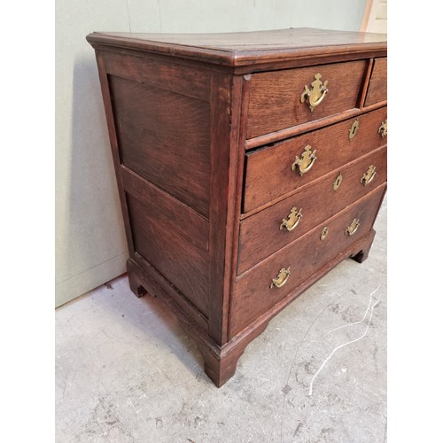 1026 - An 18th century oak panelled chest of drawers, 87cm wide.   ... 