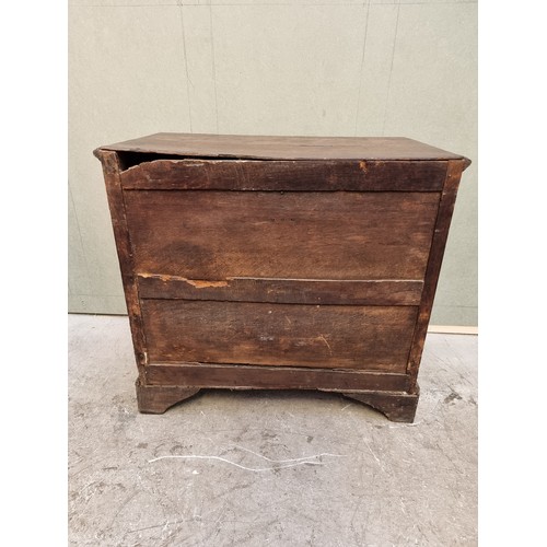 1026 - An 18th century oak panelled chest of drawers, 87cm wide.   ... 