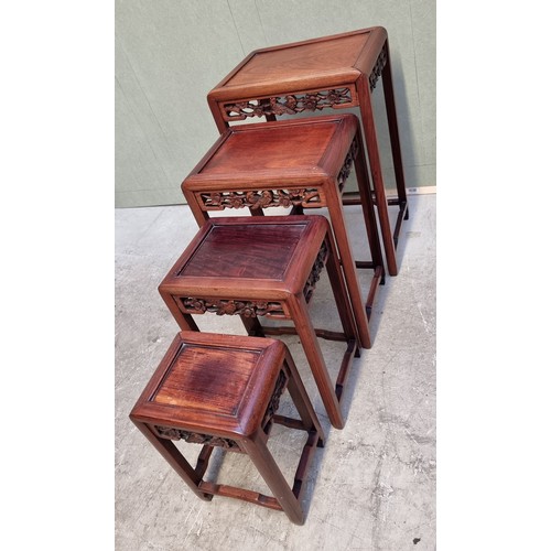 1053 - A set of four Chinese carved hardwood quartetto tables, largest 46cm wide.