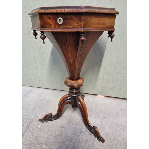 1073 - A Victorian rosewood octagonal trumpet form work table, 43cm wide.