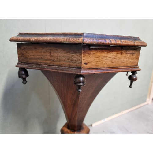 1073 - A Victorian rosewood octagonal trumpet form work table, 43cm wide.