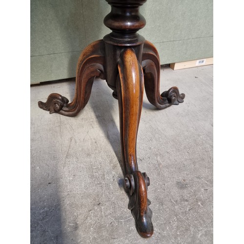 1073 - A Victorian rosewood octagonal trumpet form work table, 43cm wide.