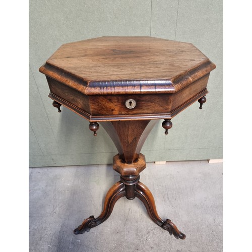 1073 - A Victorian rosewood octagonal trumpet form work table, 43cm wide.