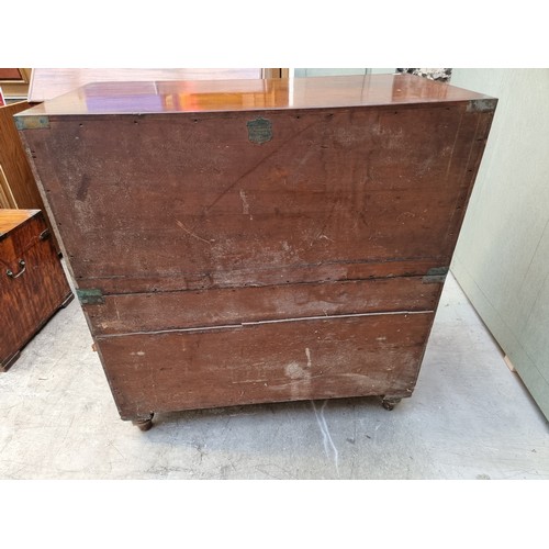 1077 - An antique teak and brass bound campaign chest, labelled 'Manufactured by S W Silver & Co,...Lon... 