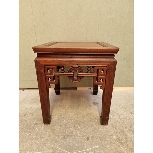 1085 - A Chinese carved hardwood low occasional table, 54cm high x 46.5cm wide. 