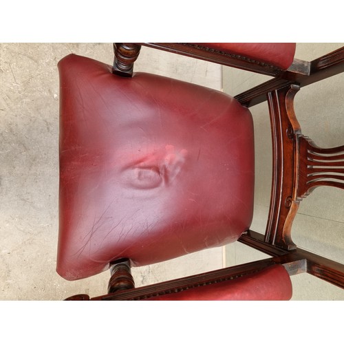 1092 - A good circa 1900 carved mahogany and red leather desk chair. 