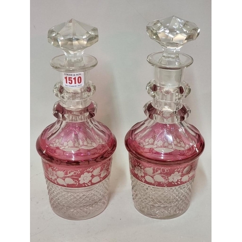 1401 - A good pair of cranberry flashed cut glass decanters and stoppers, 30.5cm high; together with a cran... 