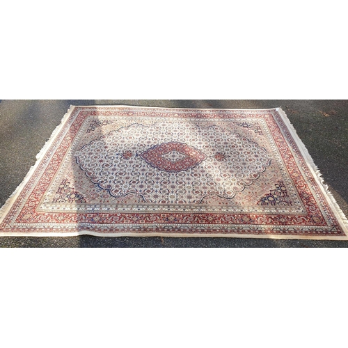 1000 - A Persian style cream and red ground carpet, 310 x 240cm