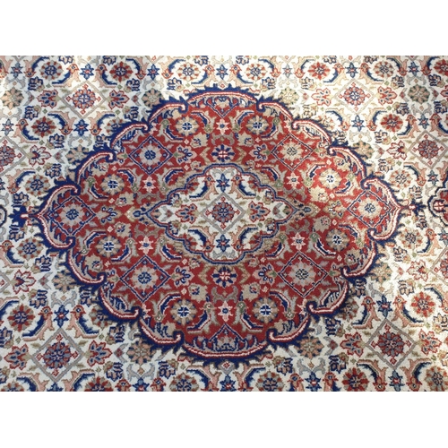 1000 - A Persian style cream and red ground carpet, 310 x 240cm