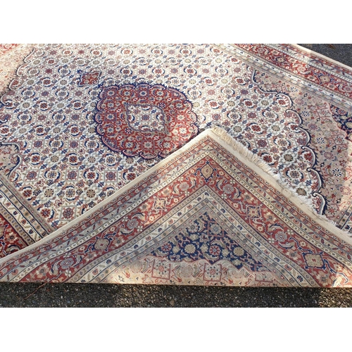 1000 - A Persian style cream and red ground carpet, 310 x 240cm