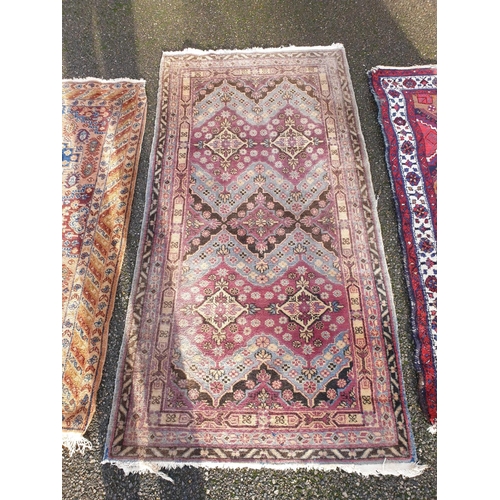 1002 - Three small rugs, 175 x 88.5cm; 147 x 80cm; and 150 x 107cm. (3)