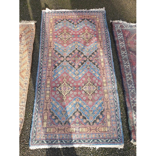 1002 - Three small rugs, 175 x 88.5cm; 147 x 80cm; and 150 x 107cm. (3)