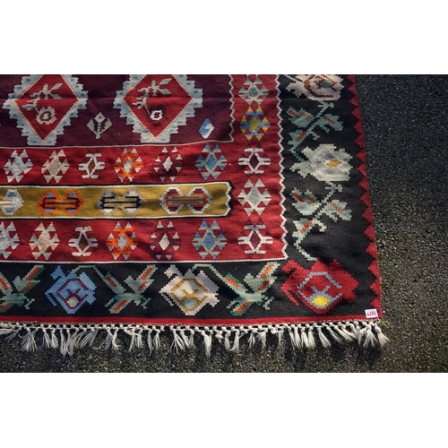 1006 - WITHDRAWN FROM SALE A Caucasian flatweave rug, having nine diamond medallions to central field, with... 