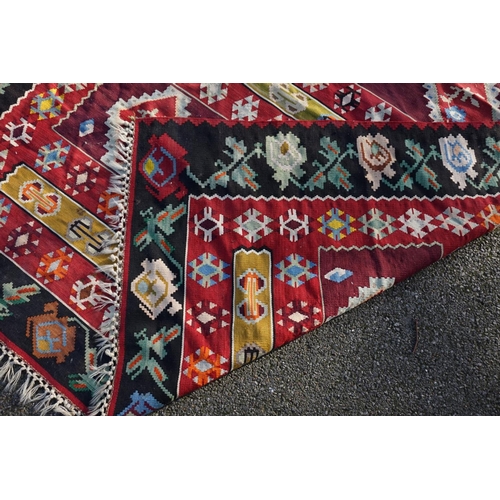 1006 - WITHDRAWN FROM SALE A Caucasian flatweave rug, having nine diamond medallions to central field, with... 