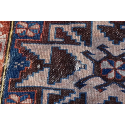 1007 - A small Persian rug, having three central medallions, with geometric borders, 142 x 92cm.... 