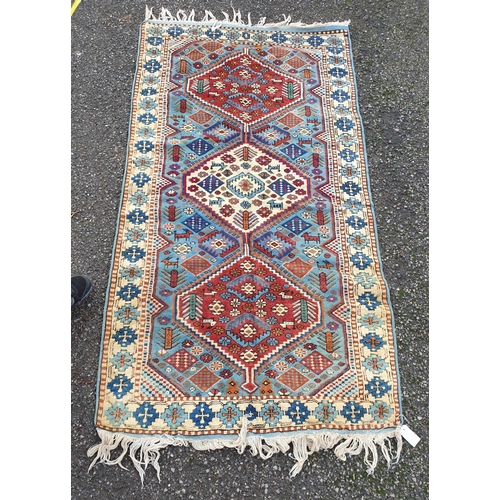 1009 - A Caucasian rug, 194 x 102.5cm.