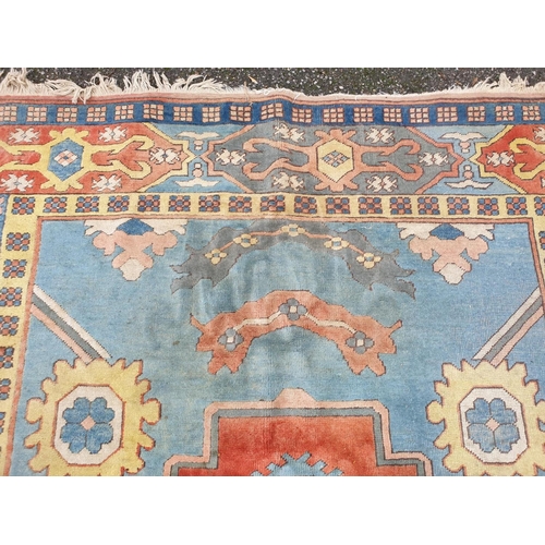 1011 - A large Turkish pale blue ground carpet, 320 x 237cm, (some staining).