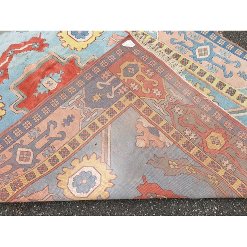 1011 - A large Turkish pale blue ground carpet, 320 x 237cm, (some staining).