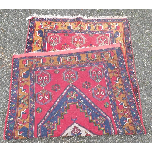 1013 - A Persian red ground rug, 227 x 113cm.