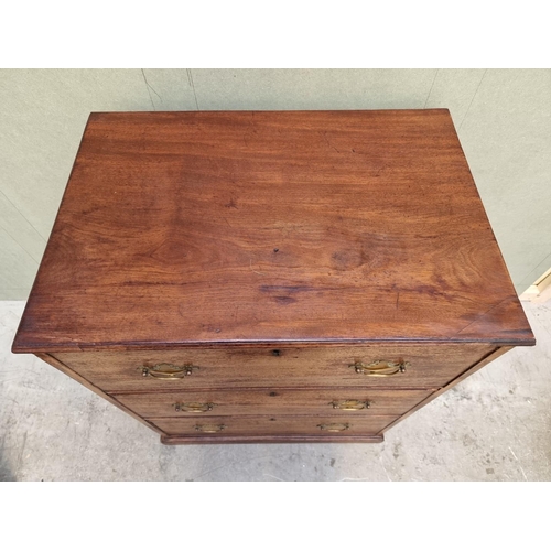 1022 - A George III mahogany three drawer chest, 75cm wide.