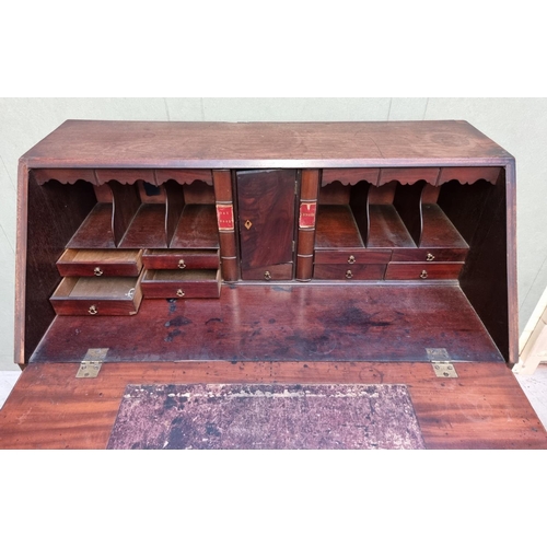 1024 - A George III mahogany bureau, 97cm wide.