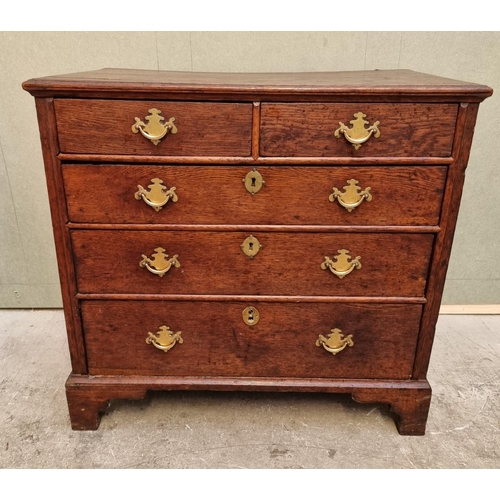 1026 - An 18th century oak panelled chest of drawers, 87cm wide.   ... 