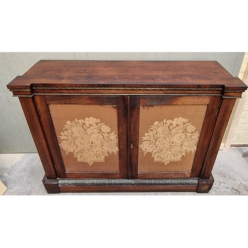 1030 - A George IV rosewood and gilt brass side cabinet, with fabric panel doors, 132.5cm wide.... 