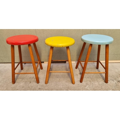 1031 - A set of three 1960s coloured seat stools, (minor variations to height), largest 46.5cm high. ... 