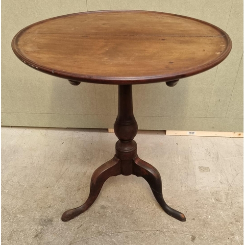 1034 - Two mahogany tilt-top tripod tables, comprising: a George III circular example, 60cm diameter; and a... 