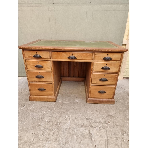 1035 - An antique pitch pine pedestal desk, 122cm wide. 