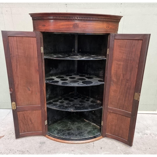 1036 - A George III mahogany and inlaid bowfront hanging corner cupboard, 119 x 78cm.