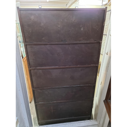 1050 - An early 20th century oak five tier sectional bookcase, 89cm wide.