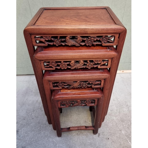 1053 - A set of four Chinese carved hardwood quartetto tables, largest 46cm wide.