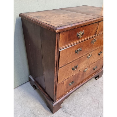 1055 - An 18th century walnut, feather and crossbanded chest of drawers, 94.5cm wide.