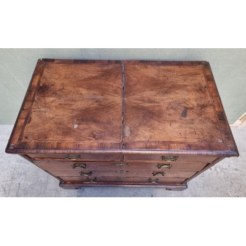 1055 - An 18th century walnut, feather and crossbanded chest of drawers, 94.5cm wide.