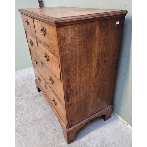 1056 - A George III oak and walnut crossbanded chest of drawers, 93.5cm wide. 