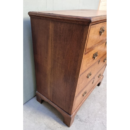 1056 - A George III oak and walnut crossbanded chest of drawers, 93.5cm wide. 