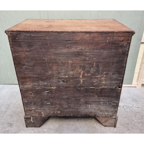 1056 - A George III oak and walnut crossbanded chest of drawers, 93.5cm wide. 