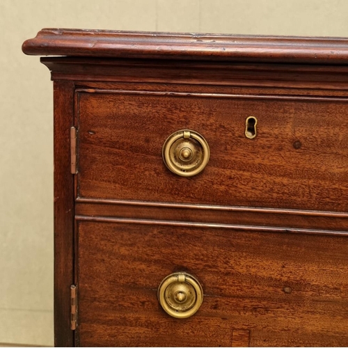 1058 - A George III mahogany commode chest, 65cm wide.