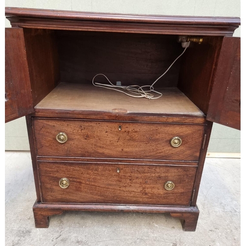 1058 - A George III mahogany commode chest, 65cm wide.