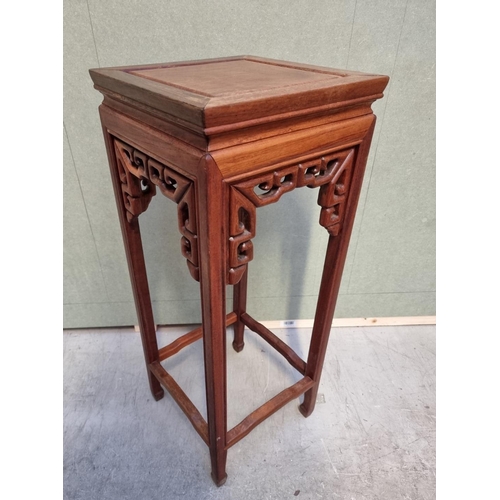 1060 - A Chinese hardwood jardiniere stand, 30.5cm wide.