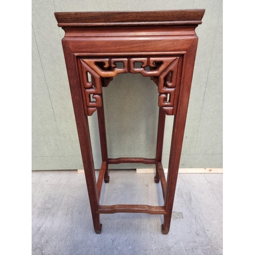 1060 - A Chinese hardwood jardiniere stand, 30.5cm wide.