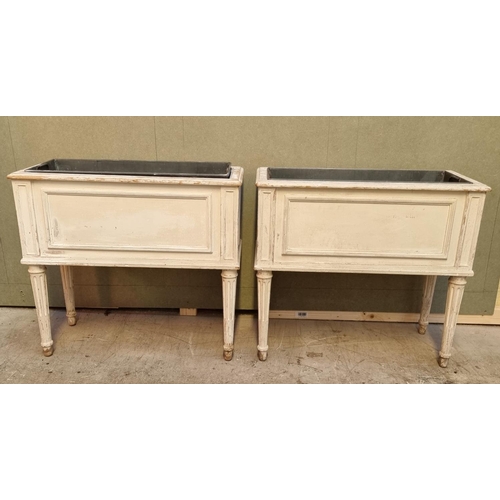 1065 - A pair of Louis XVI style white painted rectangular jardinieres, 66cm wide.